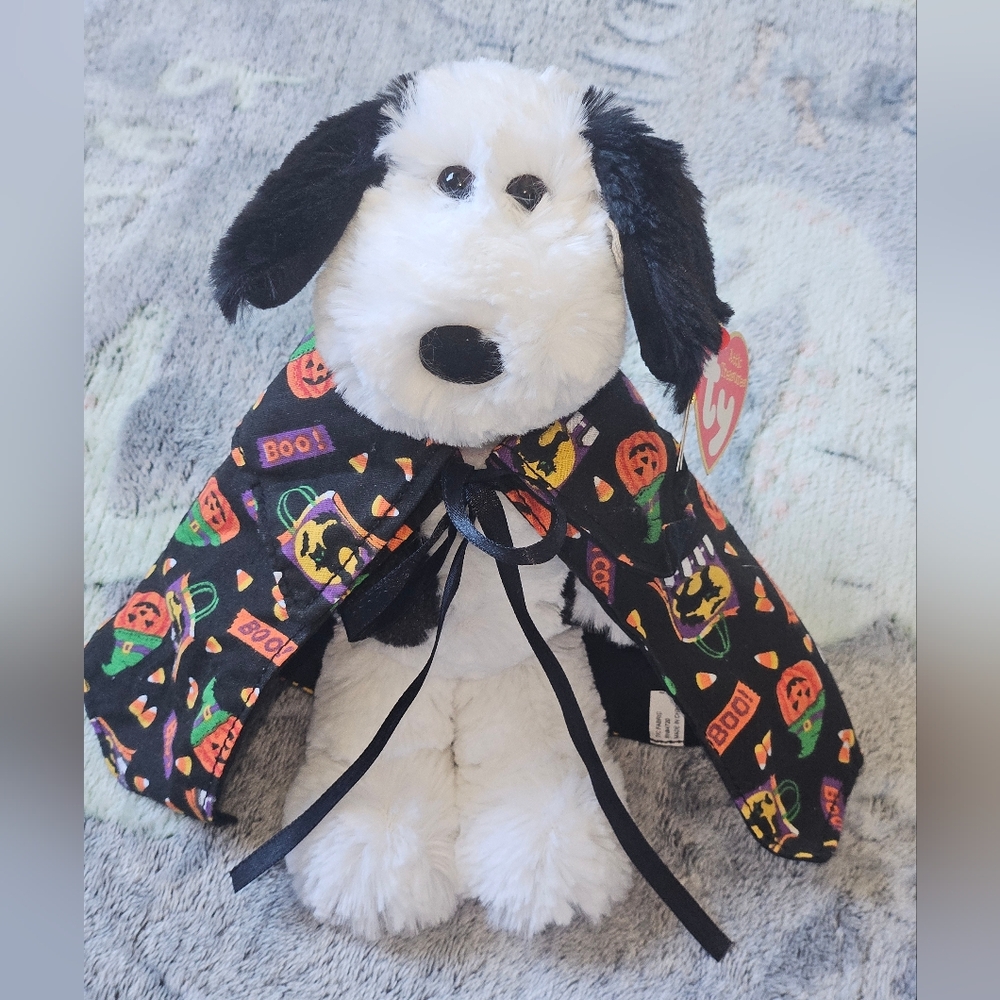 Rare Vintage Attic Treasures "Muggy" the dog wearing a Halloween-themed cape